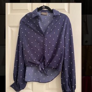 Navy polka dot blouse. Tie in front, slightly cropped.